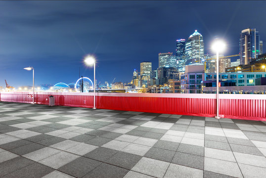 marble floor with cityscape of seattle at night