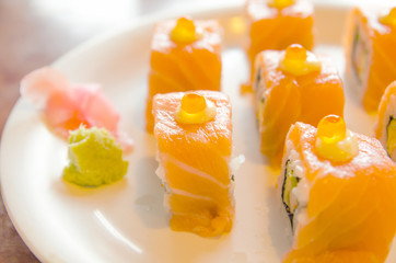 shusi salmon roll on white plate