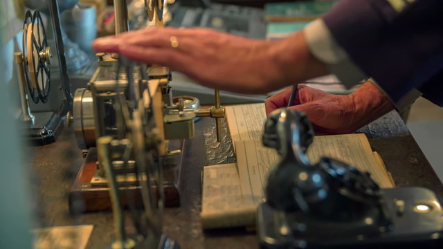 Man receiving the telegraph in Morse code 
