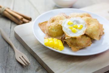 Kanom Krok on wooden table. Kind of Thai sweetmeat , thai desser