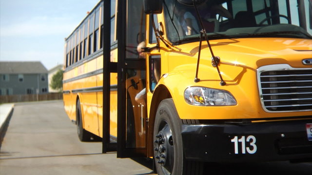 Children get off school bus