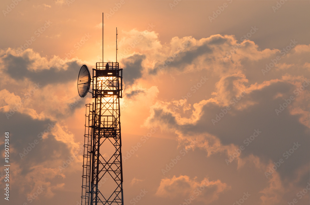 Wall mural communication tower at sunrise