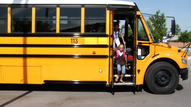 Students getting off school bus