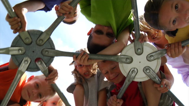 Children climbing on play equipment