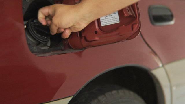Filling car with gas, close up