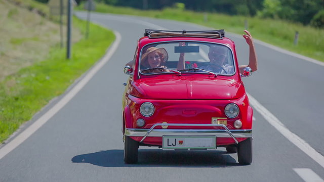 Senior couple enjoying a car ride in the countryside