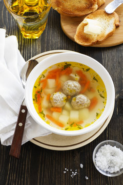 Chicken soup with meatballs.