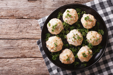 Homemade meatballs with parsley on the plate. horizontal top view
