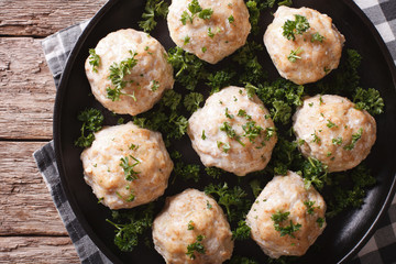 Delicious chicken meatballs with parsley on the plate. horizontal top view 
