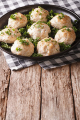 Homemade meatballs with parsley on the plate. vertical
