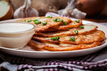 Potato pancakes with sour cream