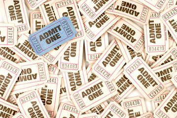 Admit one white movie cinema ticket lots scattered background with one unique individual blue ticket photo