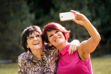 Senior mother and daughter selfie