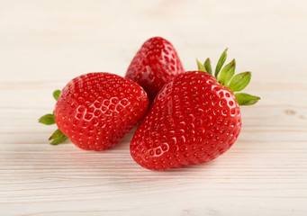strawberries on a wooden background