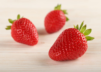 strawberries on a wooden background