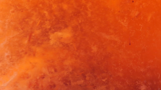 Move the different particles and patches of strawberries in strawberry juice.