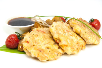 shrimp patties of meat with a salad of eggplant on a white background in restorne