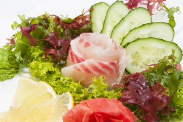 Japanese cuisine sashimi with vegetables and fish in a restaurant