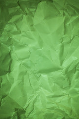 Paper background, Crumpled green paper texture.