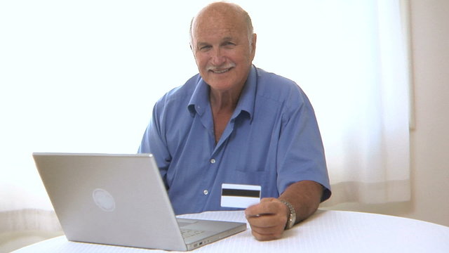 Senior man shopping online