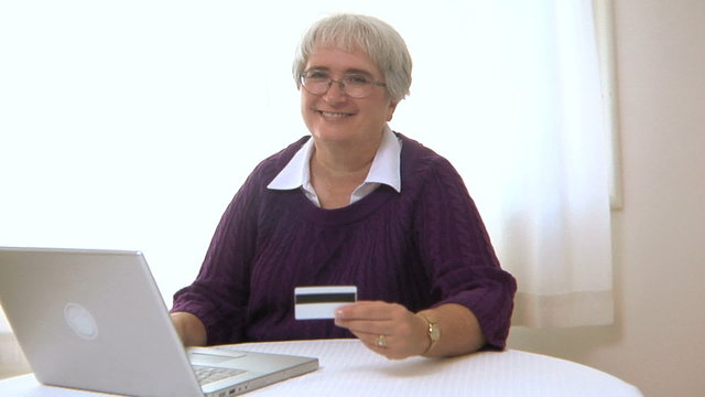 Senior woman shopping online