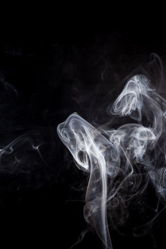 White smoke on a black background.