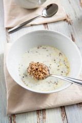 Table set for Breakfast. Buckwheat Porridge with Milk in White Bowl.