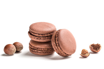 Sweet macaroons with nut on white background