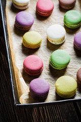Tasty macaroons on baking paper