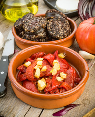 fried peppers and sausage served on wooden