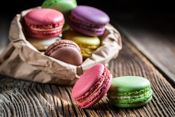 Delicious macaroons in paper bag