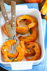 Slices fried pumpkin in the pan.