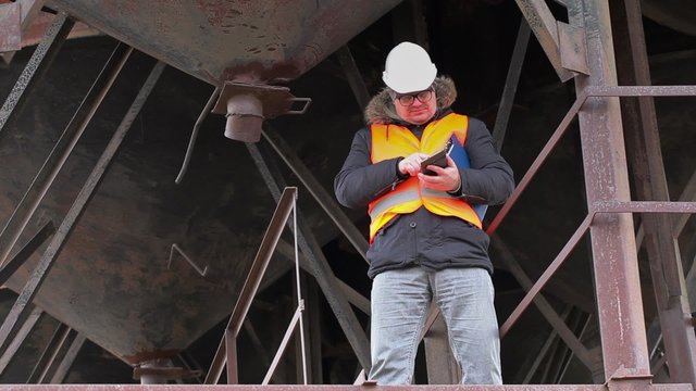 Engineer checking tanks