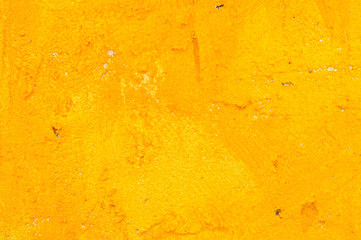 Yellow grunge cement wall for texture background