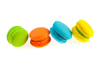 Colorful french macaroons on a white background.
