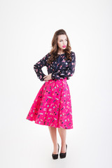 Fototapeta premium Beautiful pensive young woman with long curly hair