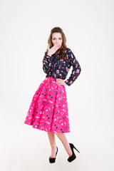 Amazed pretty young woman covered mouth with hand