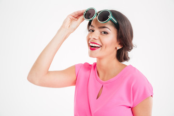 Happy attractive young woman with sunglasses smiling