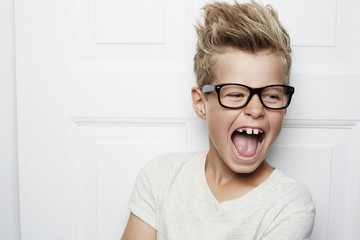 Shouting boy with spectacles and spiky hair