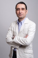  businessman standing on grey background