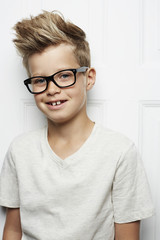 Fototapeta premium Spiky haired boy in t-shirt, smiling