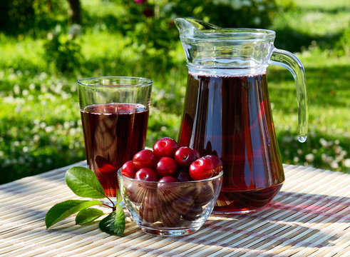 Cherry Juice In A Glass And Carafe