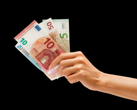 Woman's Hand Holding Euro Money Isolated On Black Background