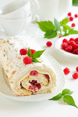 meringue roulade with cream and raspberries
