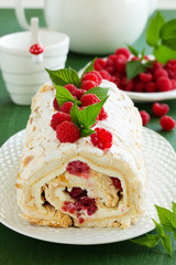 meringue roulade with cream and raspberries