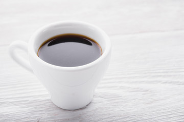 White cup of espresso coffee