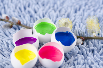Easter decoration with egg shells and filled with tempera paints