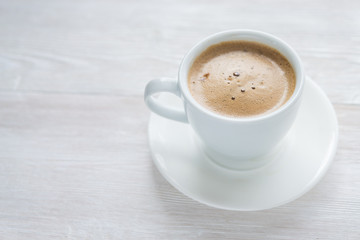 White cup of espresso coffee