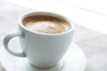 White cup of espresso coffee