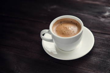 White cup of espresso coffee